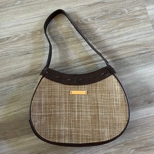 Reaction Kenneth Cole brown purse with button snap zipper pocket inside.